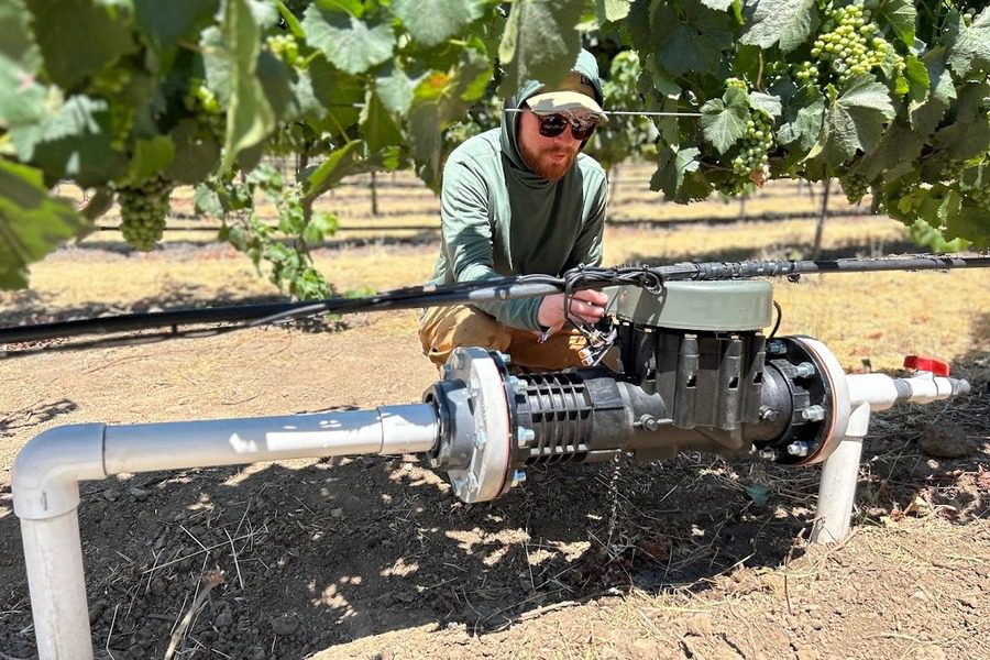 Josh installing a 4 inch valve in the field and reducing irrigation maintenance costs.