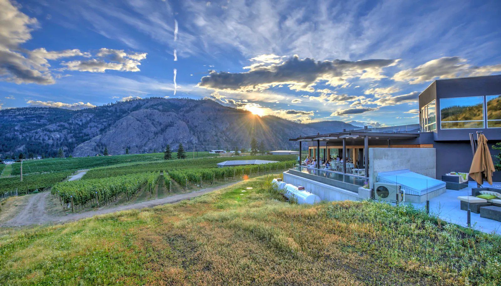 The Liquidity Wines patio at sunset, overlooking the vineyard and mountains